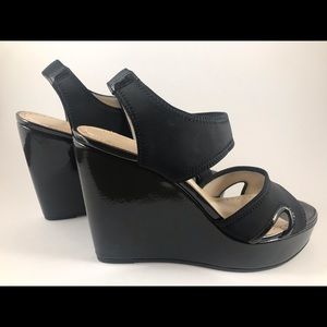 Women’s black patent clogs